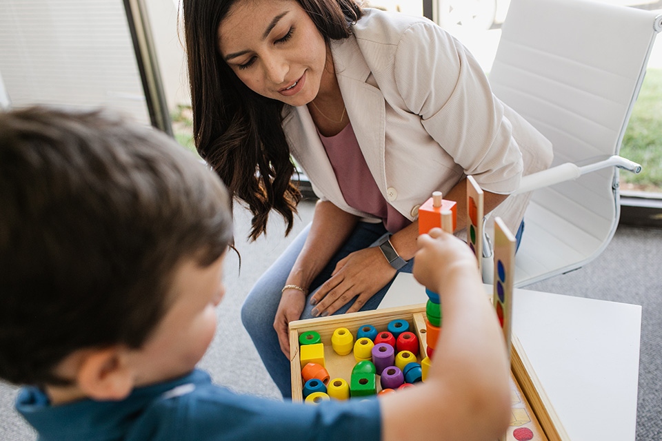 ONE Blog Rockstar Woman watching child play
