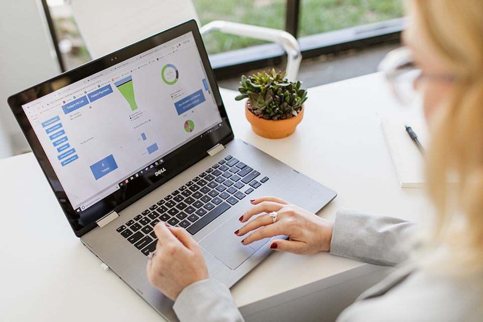 ONE Member Benefits transform Woman on laptop