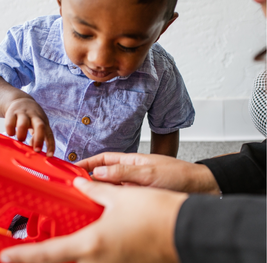 Child laughing Child looking at toy